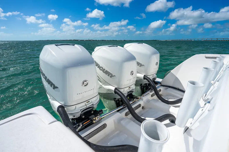 Slide: The Image of 2016 Intrepid 400 Center Console with triple Mercury outboard engines on open water. - 17