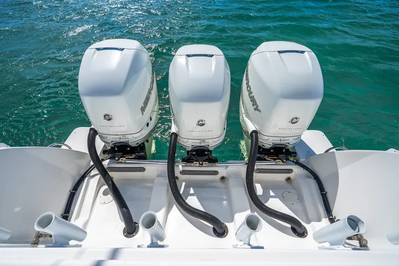 Slide: The Image of 2016 Intrepid 400 Center Console with triple Mercury outboard engines on open water. - 18