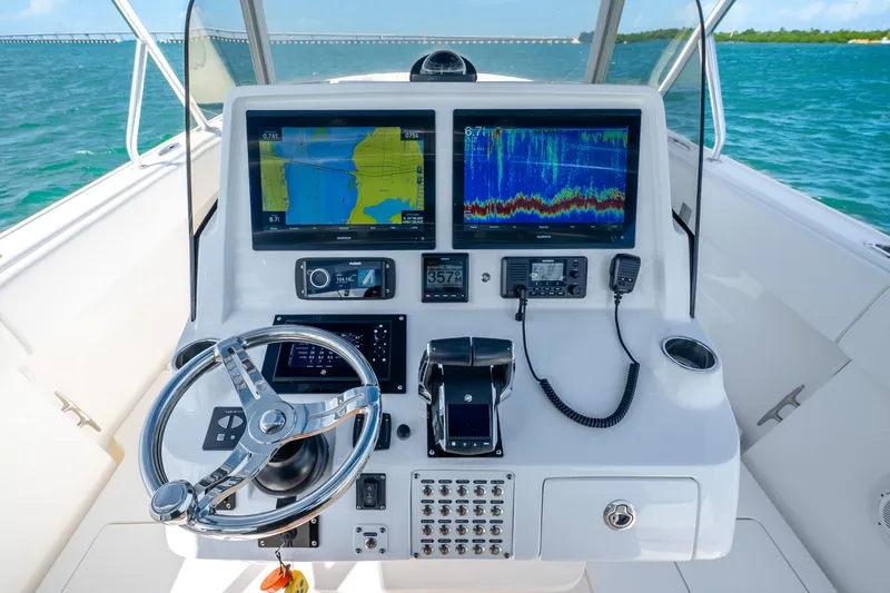 Slide: The Image of Triple Mercury outboard engines on a 2016 Intrepid 400 Center Console boat. - 19