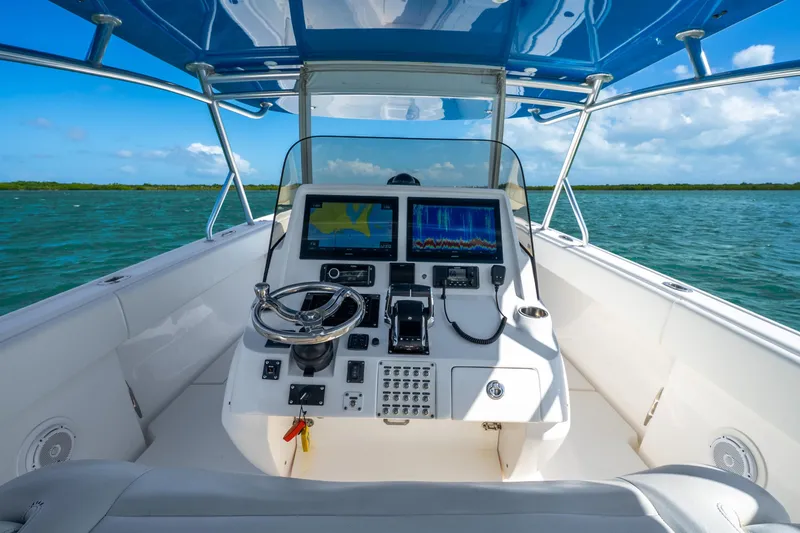 Slide: The Image of 2016 Intrepid 400 Center Console helm with advanced navigation displays and controls. - 23