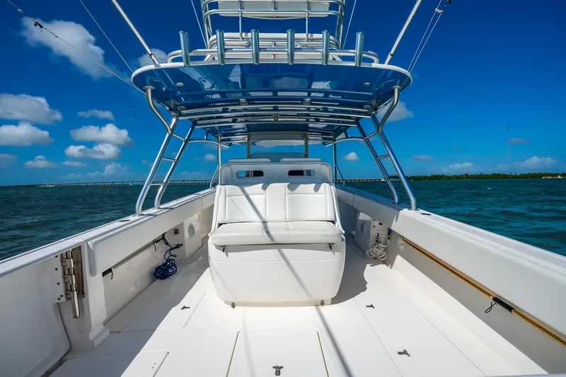Slide: The Image of 2016 Intrepid 400 Center Console boat deck under a clear blue sky. - 38