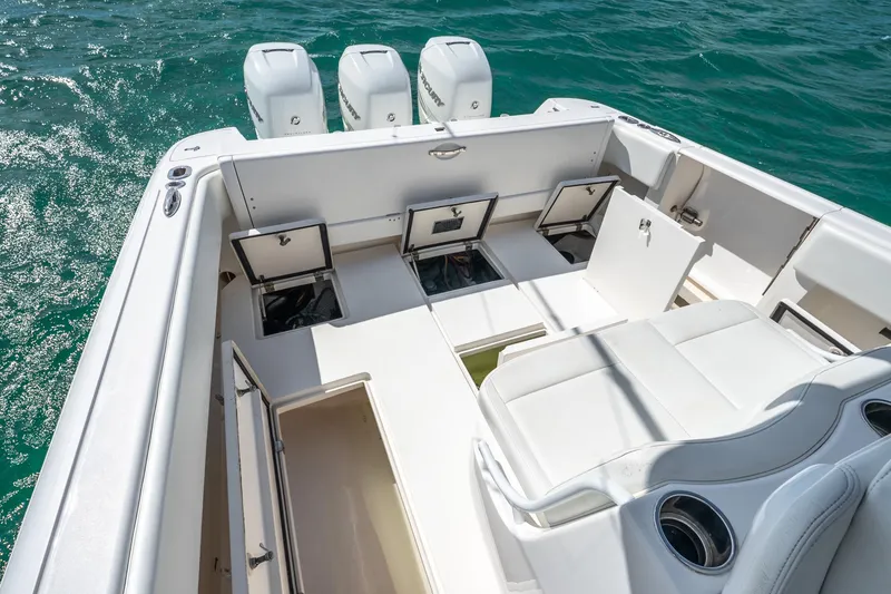Slide: The Image of 2016 Intrepid 400 Center Console boat with open storage compartment and white seating. - 41