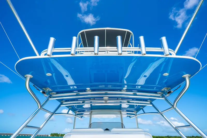 Slide: The Image of 2016 Intrepid 400 Center Console boat on a scenic waterway with lush greenery. - 44