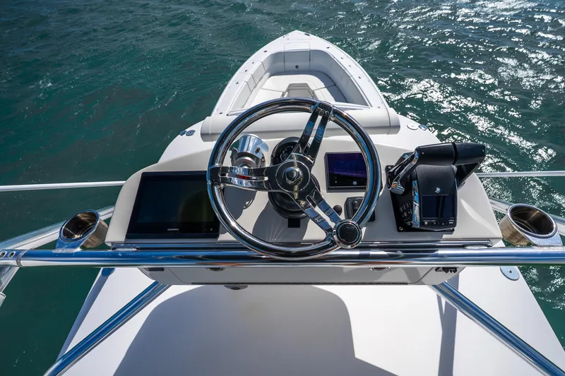 Slide: The Image of 2016 Intrepid 400 Center Console boat with Garmin equipment on open water under blue sky. - 46