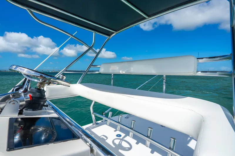 Slide: The Image of 2016 Intrepid 400 Center Console helm with ocean view, clear skies, and modern controls. - 48