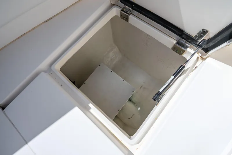 Slide: The Image of Open storage compartment on 2016 Intrepid 400 Center Console boat. - 52