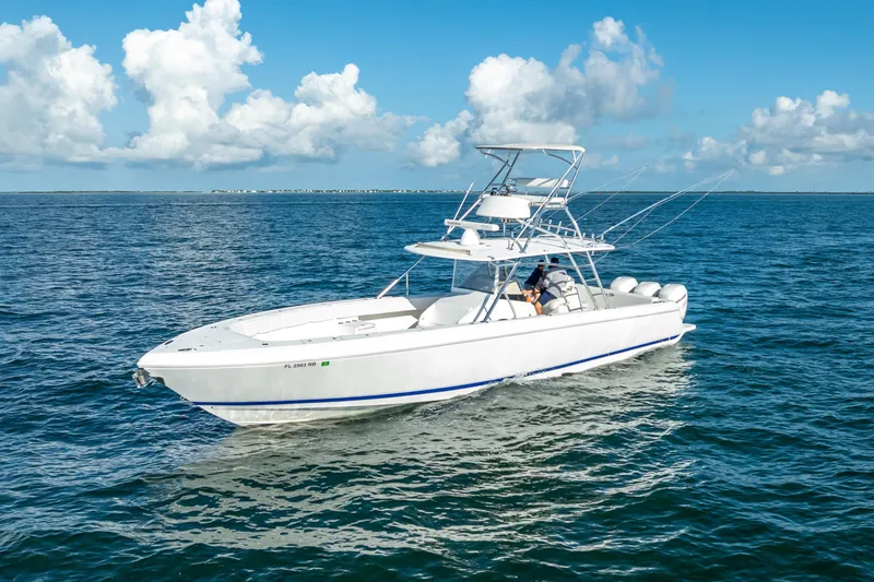 Slide: The Image of 2016 Intrepid 400 Center Console boat bathroom with toilet and sink. - 55