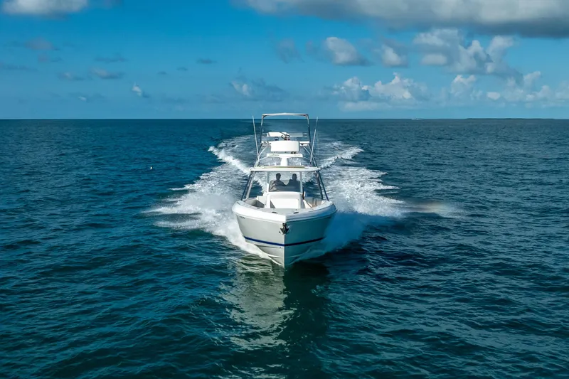 Slide: The Image of 2016 Intrepid 400 Center Console boat cruising on open water. - 57