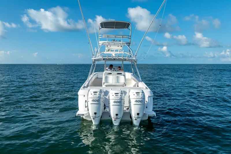 Slide: The Image of 2016 Intrepid 400 Center Console boat on open sea under blue sky. - 60
