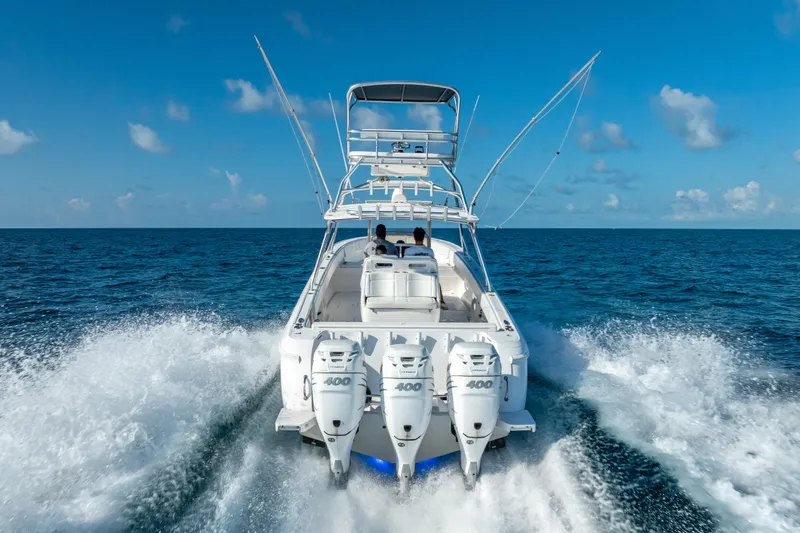 Slide: The Image of 2016 Intrepid 400 Center Console boat cruising on open ocean waters. - 65