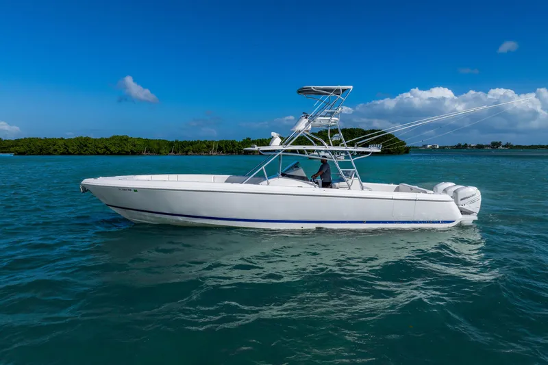 Slide: The Image of 2016 Intrepid 400 Center Console boat on clear blue water. - 9