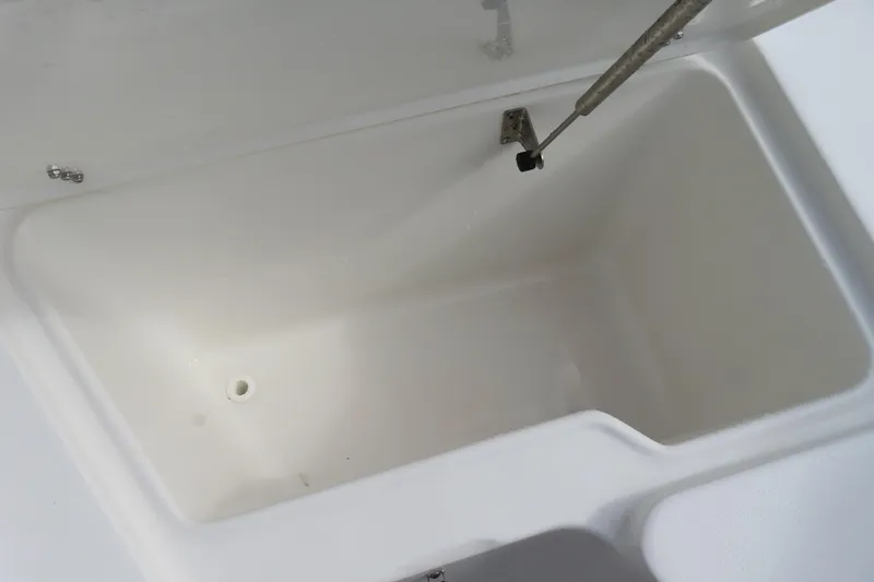 Slide: The Image of Open storage compartment in 2025 Sea Hunt Ultra 229 boat. - 10