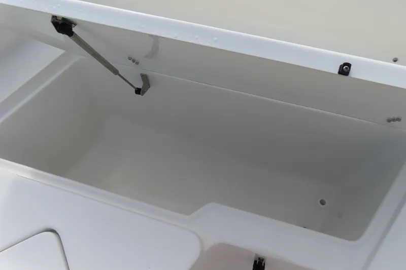 Slide: The Image of Open storage compartment on 2025 Sea Hunt Ultra 229 boat. - 11