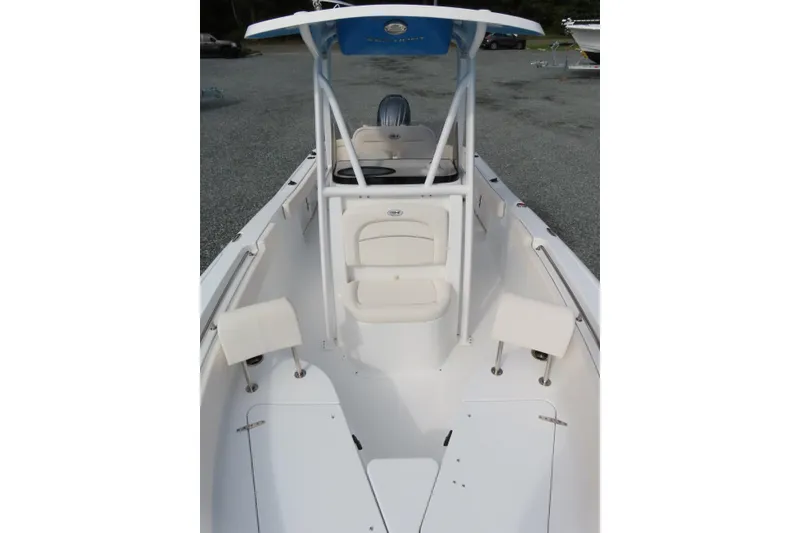 Slide: The Image of 2025 Sea Hunt Ultra 229 boat interior with seating and T-top. - 14