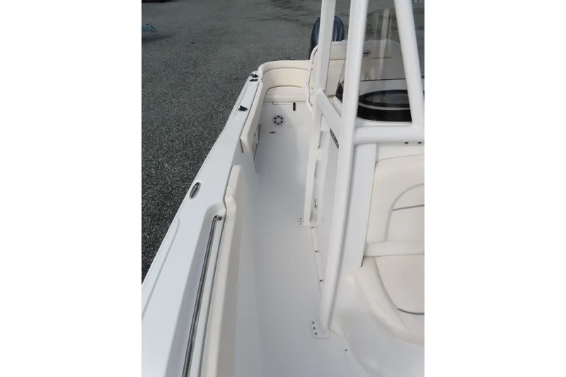 Slide: The Image of 2025 Sea Hunt Ultra 229 boat interior with white seating and sleek design. - 15