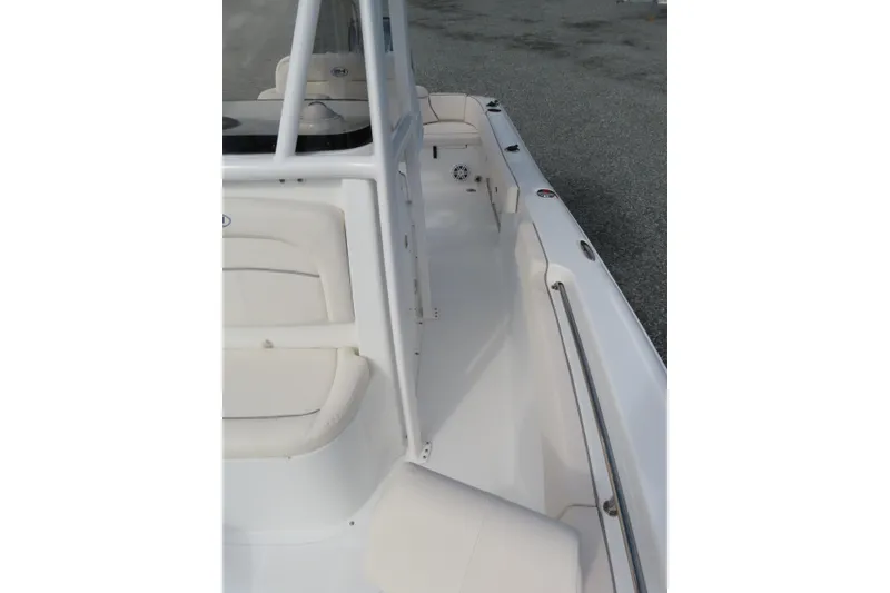 Slide: The Image of 2025 Sea Hunt Ultra 229 boat interior with white seating and sleek design. - 16
