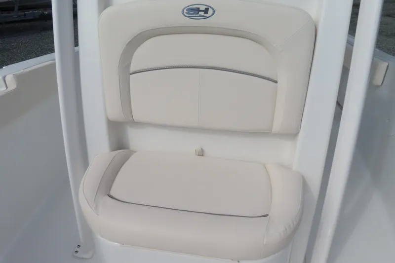 Slide: The Image of 2025 Sea Hunt Ultra 229 boat seat with white cushioned upholstery. - 17