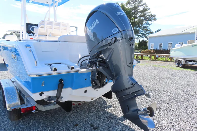 Slide: The Image of 2025 Sea Hunt Ultra 229 boat with Yamaha 200 outboard motor on trailer. - 4
