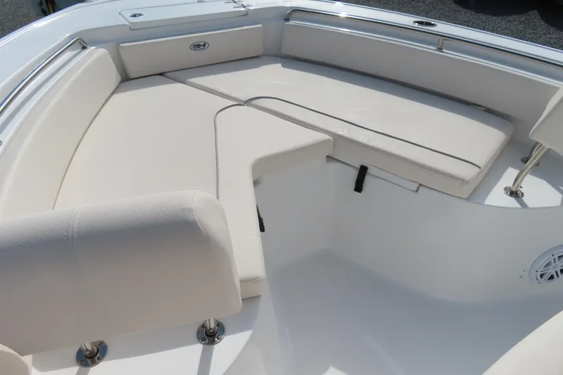 Slide: The Image of 2025 Sea Hunt Ultra 229 boat interior with cushioned seating and sleek design. - 7