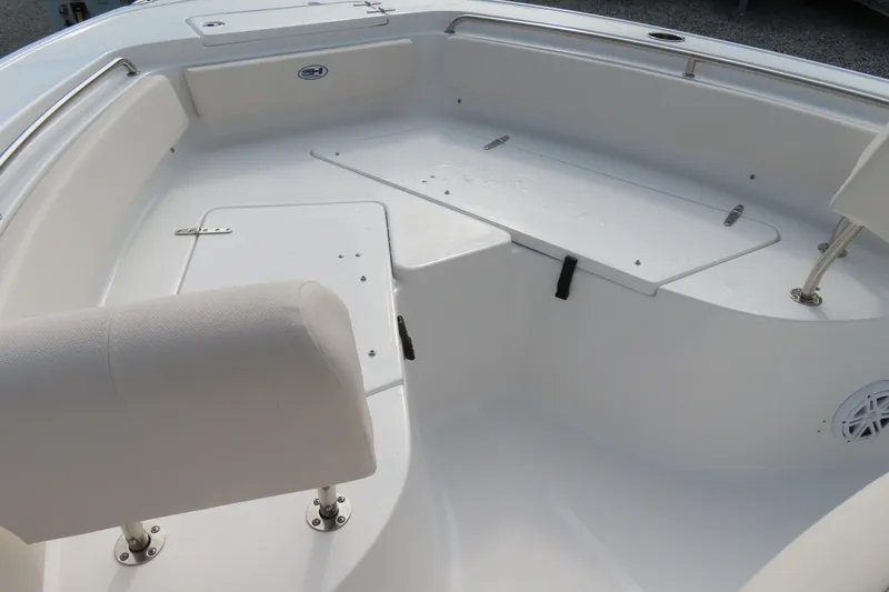 Slide: The Image of 2025 Sea Hunt Ultra 229 boat interior with seating and storage compartments. - 8