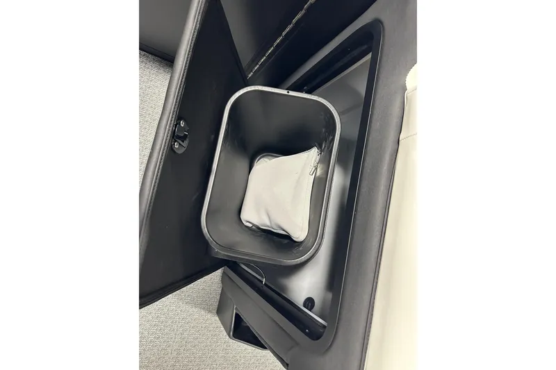 Slide: The Image of Interior storage compartment of 2026 Evotti 723CS with a removable bin. - 11