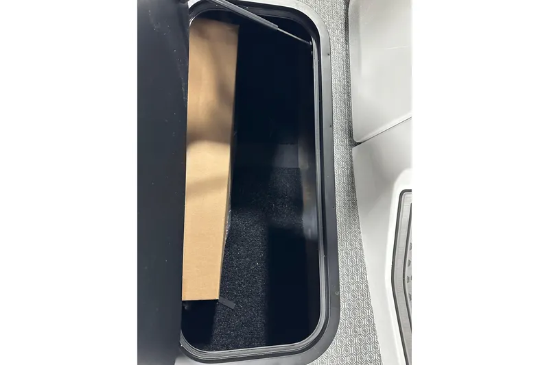 Slide: The Image of Open storage compartment in 2026 Evotti 723CS vehicle interior. - 14