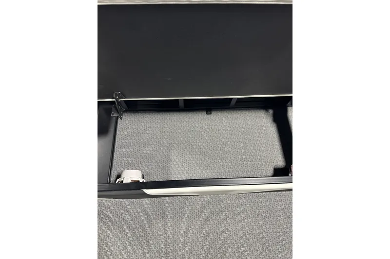 Slide: The Image of Open storage compartment in Evotti 723CS, 2026 model, with textured interior. - 20