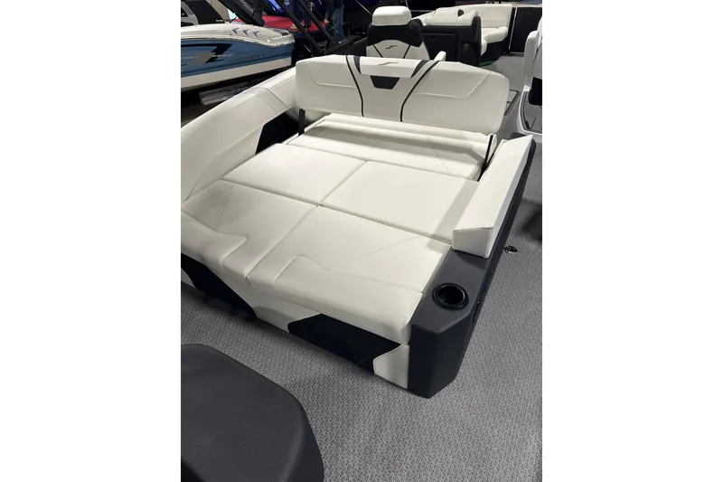 Slide: The Image of 2026 Evotti 723CS boat interior with white cushioned seating and cup holder. - 22