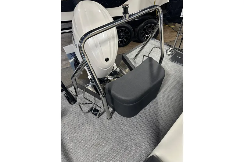 Slide: The Image of 2026 Evotti 723CS boat engine with chrome railing and cushioned seat on textured flooring. - 26