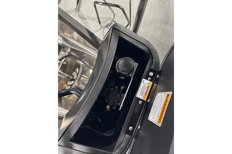 Slide: The Image of Close-up of Evotti 723CS 2026 model's internal compartment with warning labels. - 27