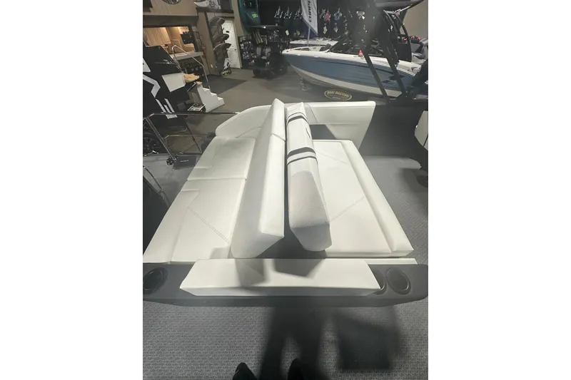 Slide: The Image of 2026 Evotti 723CS boat interior with white seating and cup holders. - 30