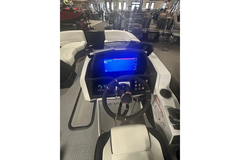 Slide: The Image of 2026 Evotti 723CS boat dashboard with modern steering wheel and digital display. - 31