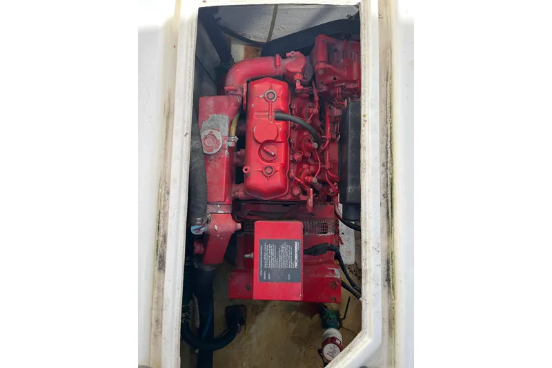 Slide: The Image of Engine compartment of a 1989 Bayliner 3888 MY Sedan with a red engine. - 23