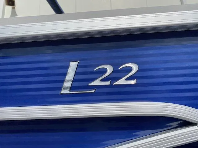 Slide: The Image of 2023 Bennington 22LFB boat model emblem on blue exterior - 3