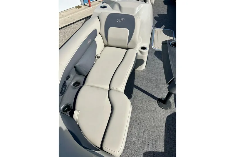 Slide: The Image of 2024 Barletta ARIA 22QC boat interior with comfortable seating and cup holders. - 13