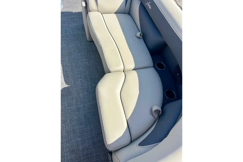 Slide: The Image of 2024 Barletta ARIA 22QC boat interior seating with cup holders, featuring elegant design. - 15