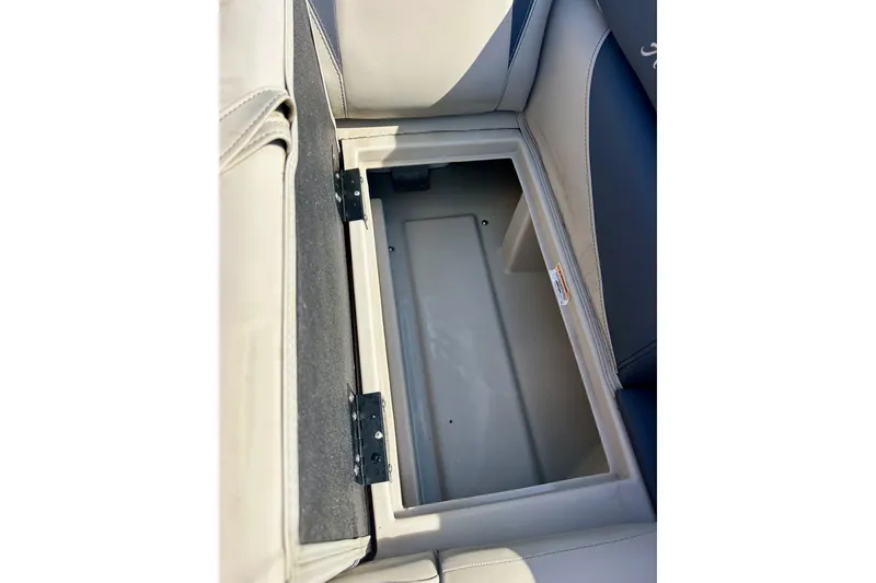 Slide: The Image of 2024 Barletta ARIA 22QC storage compartment with open seat, showcasing interior space. - 17