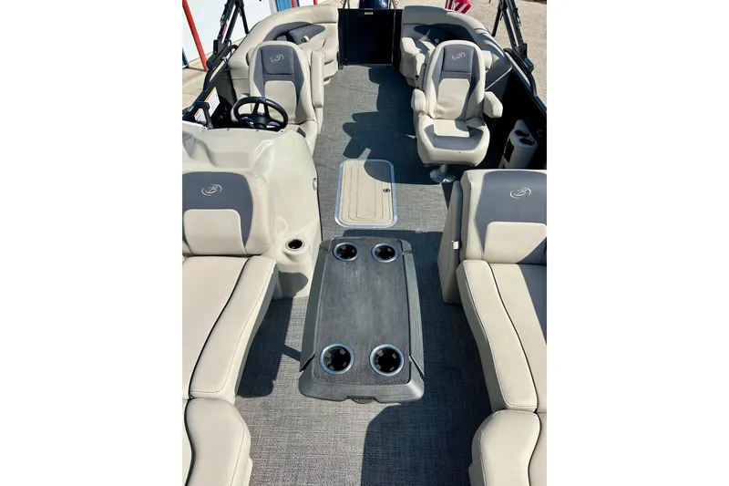 Slide: The Image of 2024 Barletta ARIA 22QC pontoon boat interior with plush seating and cup holders. - 21