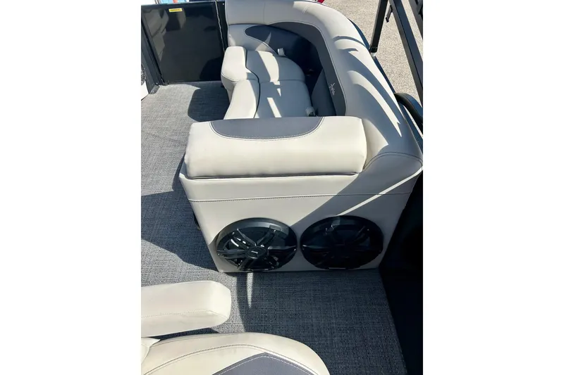 Slide: The Image of 2024 Barletta ARIA 22QC boat interior with plush seating and built-in speakers. - 35