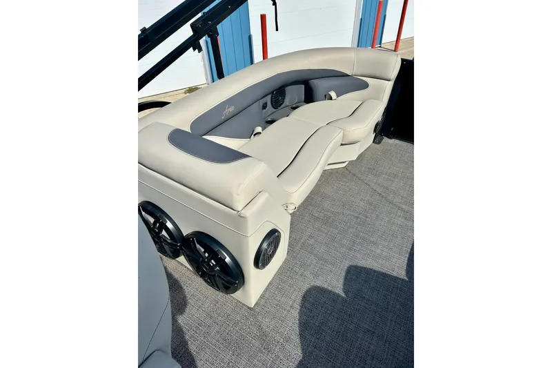 Slide: The Image of 2024 Barletta ARIA 22QC pontoon boat interior with plush seating and speakers. - 37