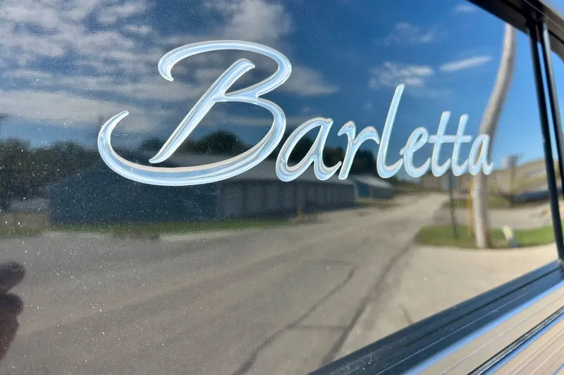 Slide: The Image of Barletta ARIA 22QC 2024 logo on reflective surface with sky reflection. - 4