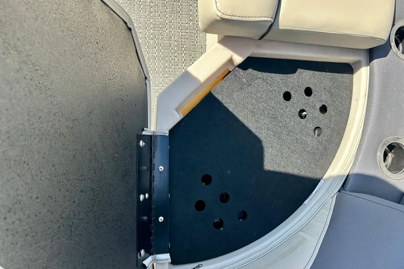 Slide: The Image of 2024 Barletta ARIA 22QC boat interior storage compartment with cushioned seating. - 47