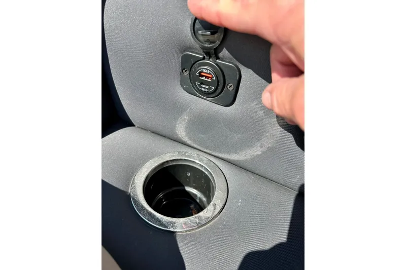 Slide: The Image of 2024 Barletta ARIA 22QC boat interior with USB port and cup holder. - 53