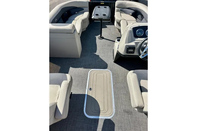 Slide: The Image of 2024 Barletta ARIA 22QC interior with plush seating and modern dashboard. - 57