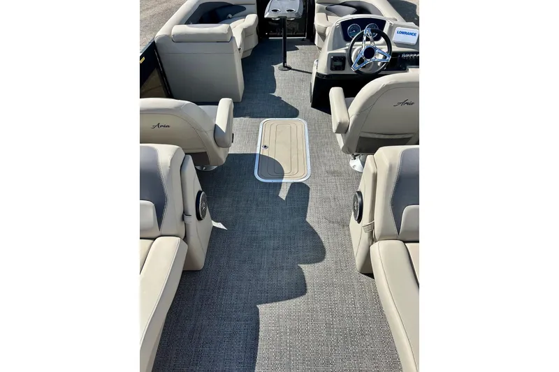 Slide: The Image of 2024 Barletta ARIA 22QC pontoon boat interior with plush seating and modern dashboard. - 58
