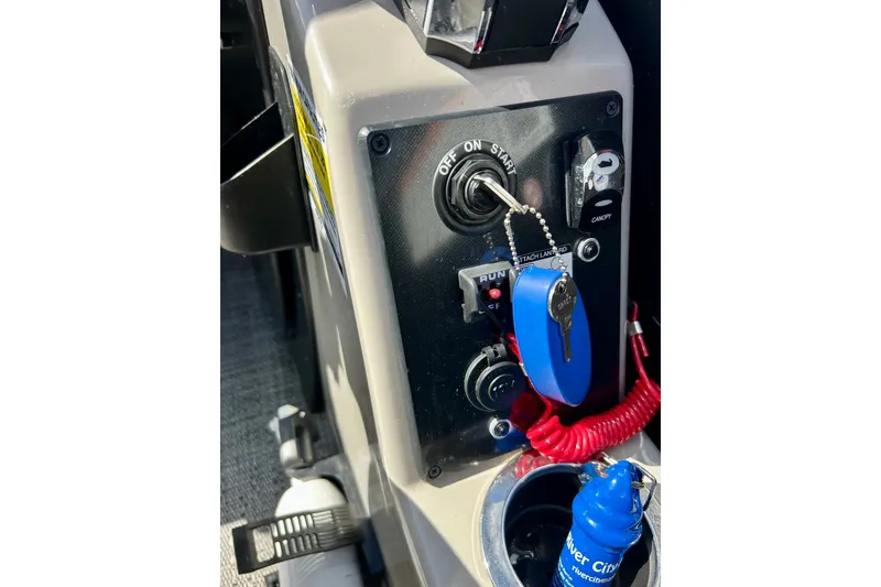 Slide: The Image of Control panel of 2024 Barletta ARIA 22QC boat with ignition key and accessories. - 60