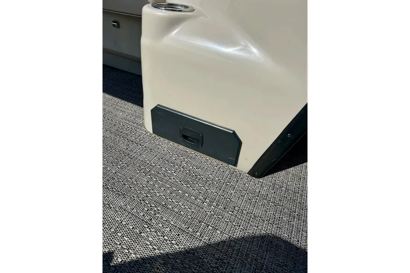 Slide: The Image of 2024 Barletta ARIA 22QC interior detail with cup holder and textured flooring. - 61