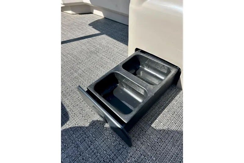 Slide: The Image of 2024 Barletta ARIA 22QC boat with retractable cup holder on textured flooring. - 62
