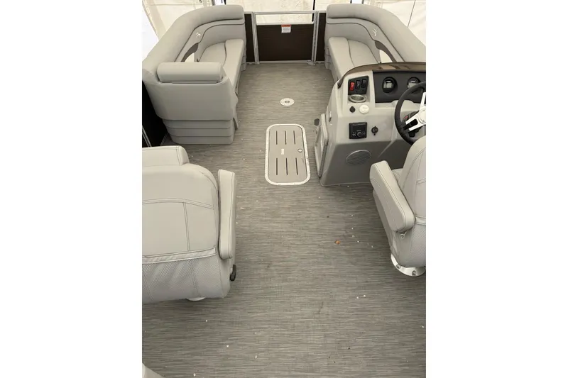 Slide: The Image of 2023 Bennington 23SSR pontoon boat interior with gray seating and steering console. - 5