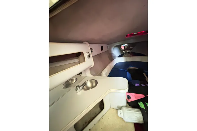Slide: The Image of 1987 Chris-Craft 312 Stinger cabin interior with sink and seating area. - 28